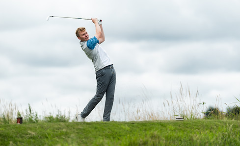 Ben hitting an iron at The Manchester Golf Club