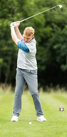 Ben hitting an iron shot at The Manchester Golf Club