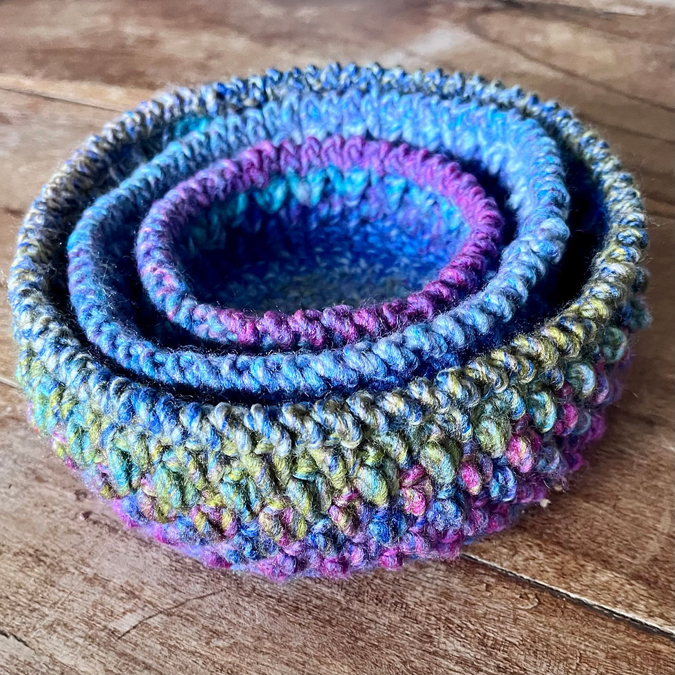 Thumbnail: set of 3  textured crochet storage basket stacked in Enchanted Skies colourway