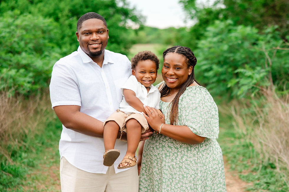 family posing for smiling photo in frisco tx