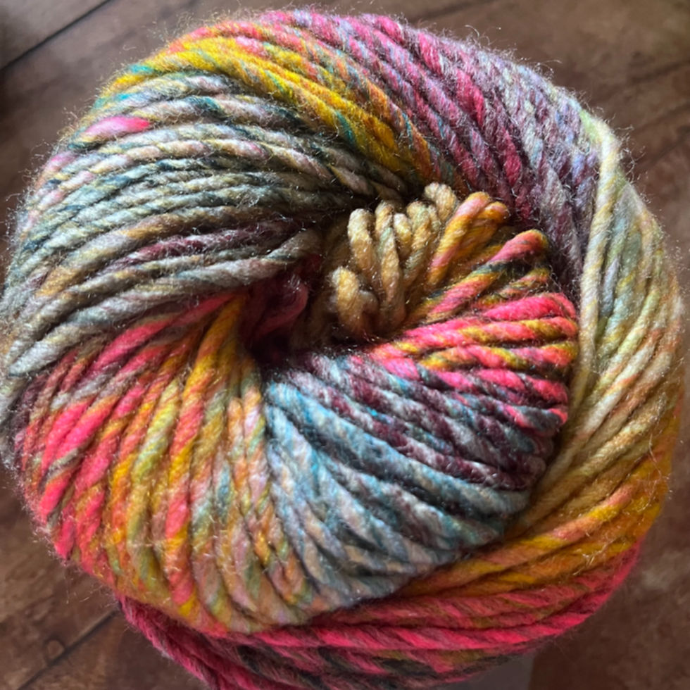 Thumbnail: Ball of yarn showing colourway on wooden table