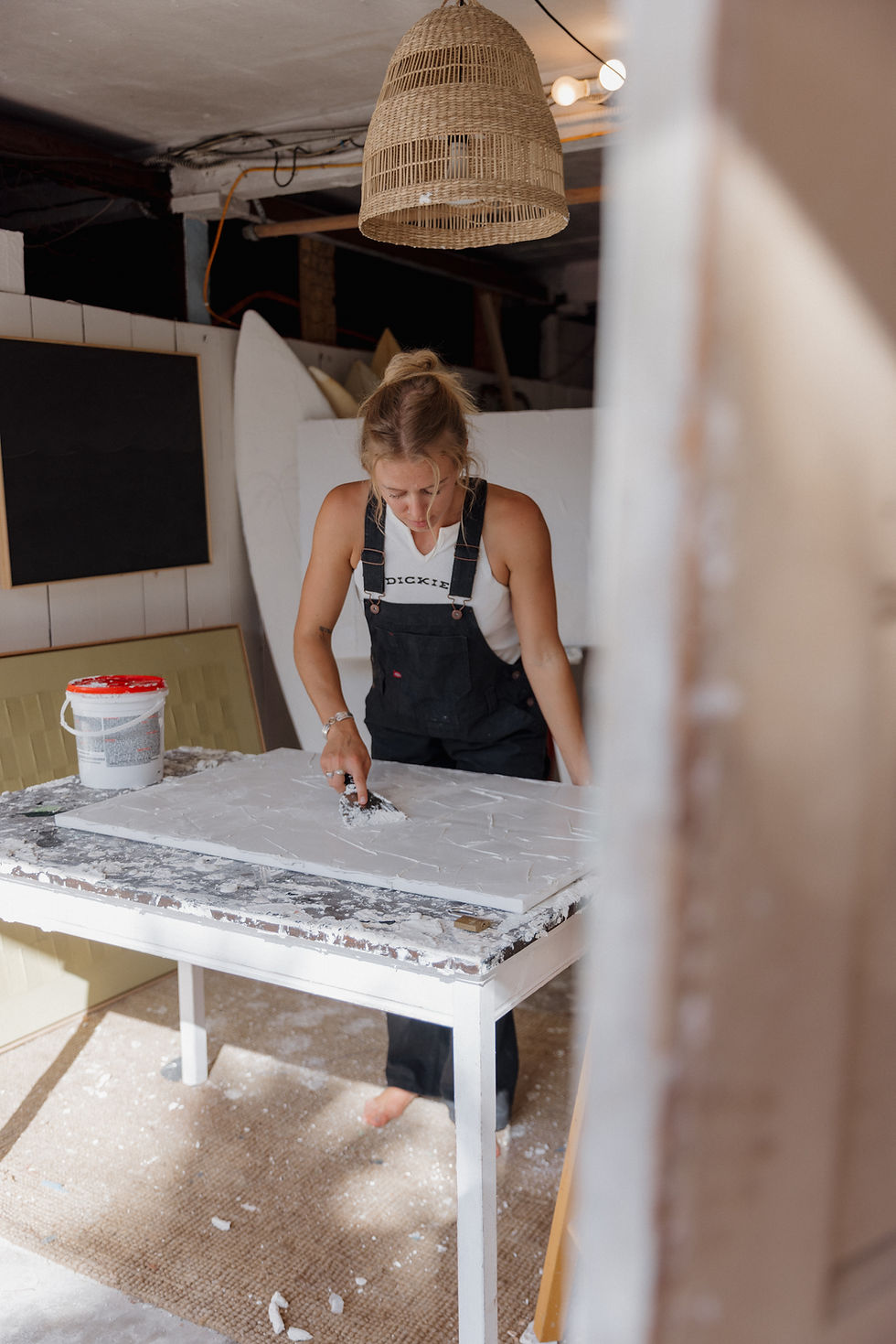 Emma working on a one-of-one piece at her studio table