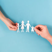 top-view-people-holding-in-hands-cute-paper-family.jpg