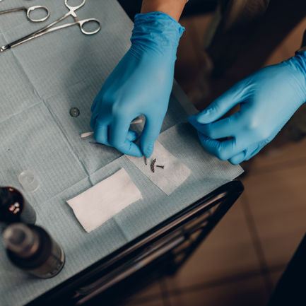 Close-up of preparing for a piercing, Huzz Ink Laser Clinic