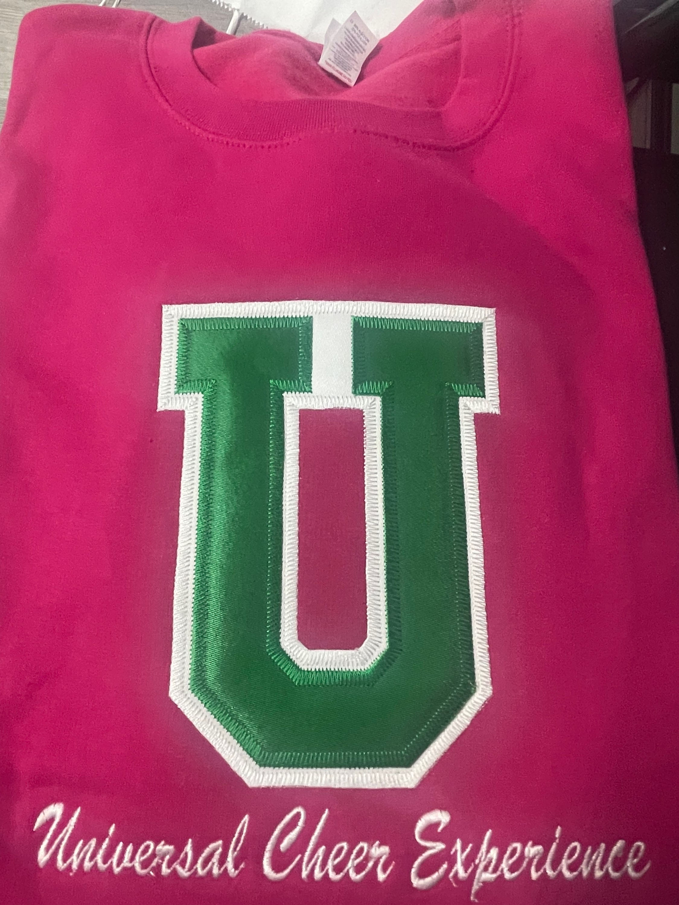 Pink sweatshirt w/green U