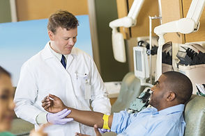 Doctor with blood donor