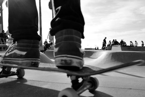 Black and White Image of a Skateboarder Vans shoes at Venice Beach skatepark