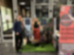 Laura Wood and Callum Lowe in front of Invisible Creations garden range stand
