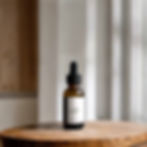 garden party car diffuser refill sitting on a wooden table.