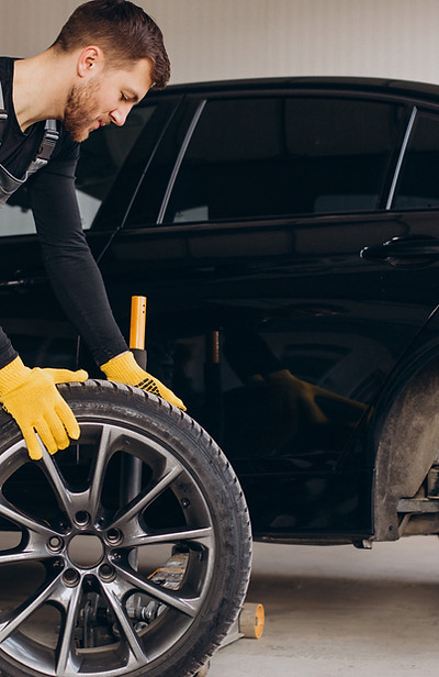 car-mechanic-changing-wheels-car-2_edite