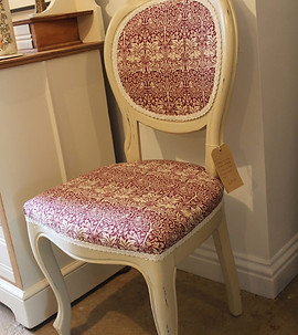 chair reupholstered with red and white patterned material