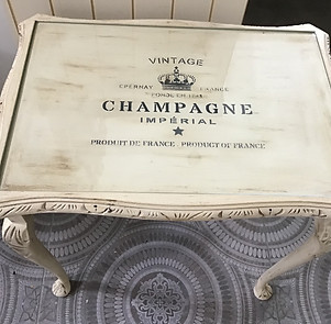 coffee table with champagne design stencil painted