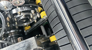 Slitter with rubber grip roll for accuracy
