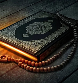 Quran holy book and rosary beads