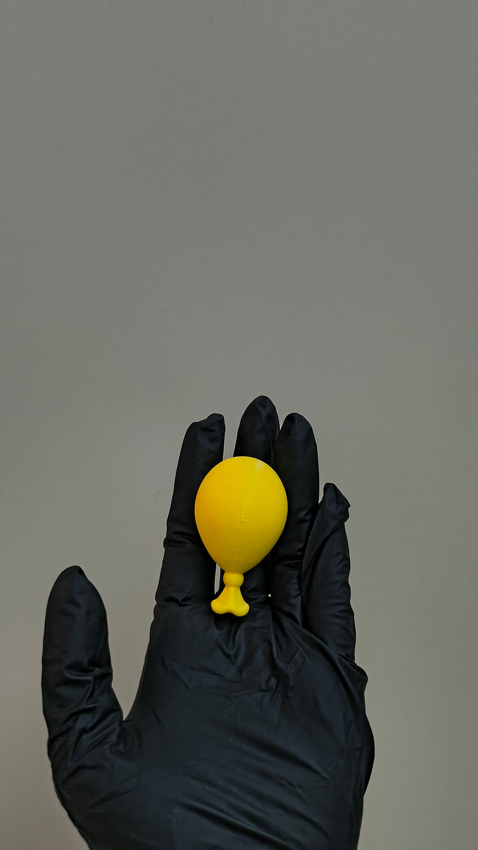 Thumbnail: Floaty balloon fridge magnet held in hand