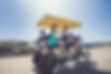 Family on Surrey at beach they rented from Salt Water Gift Shop in Galveston Texas
