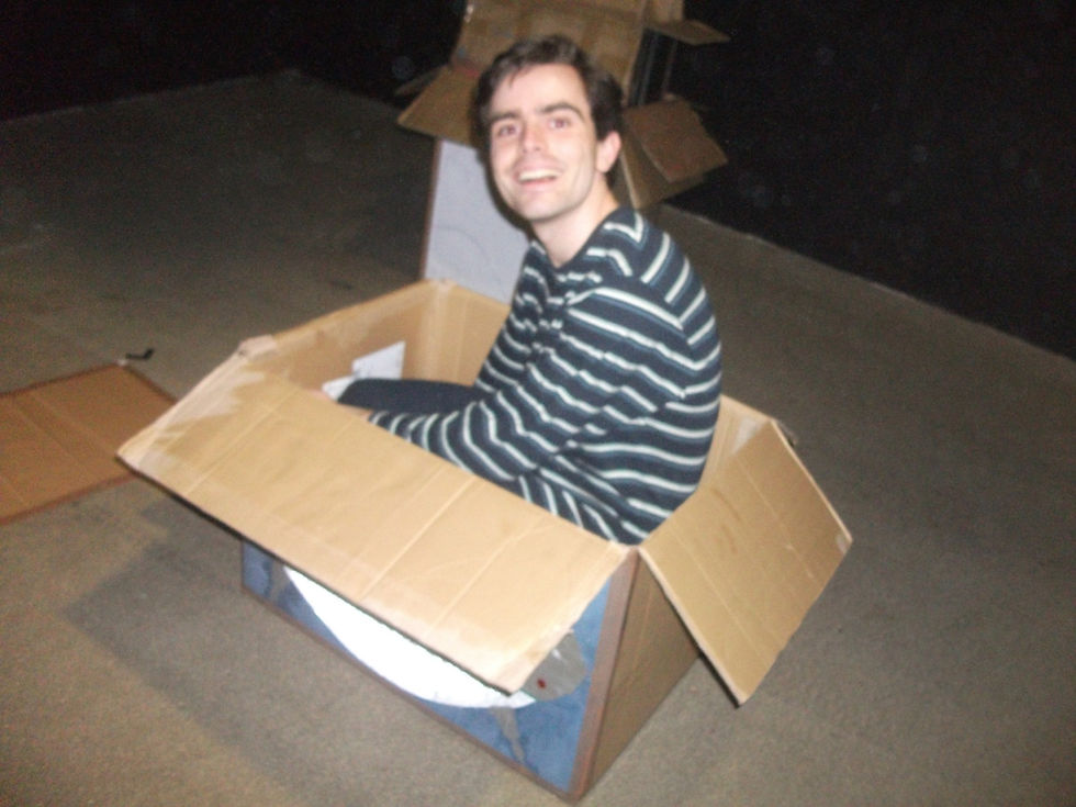 Photo of the director in the Astronaut's space ship - made from cardboard.