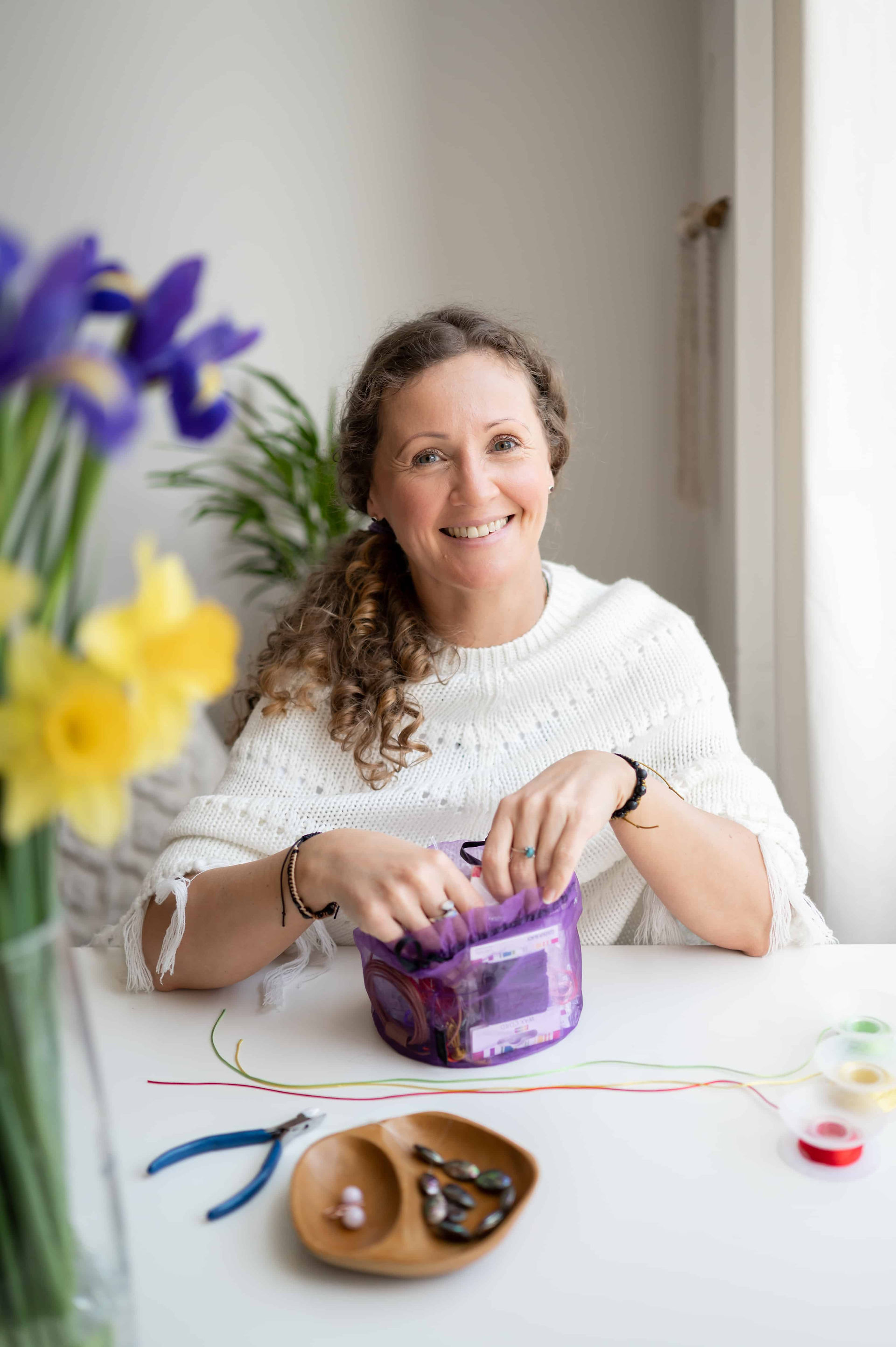 Welsh crystal healer making jewelry during her Liverpool personal branding photoshoot with Wild Kind Photography
