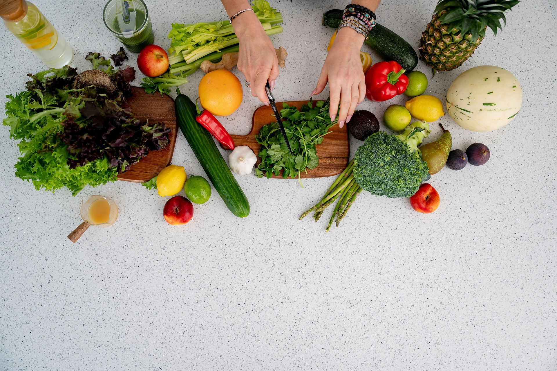 Top-down view of the nutrition-focused setup with fruit and vegetables during a Holistically Balanced Blonde North Wales brand photography session.