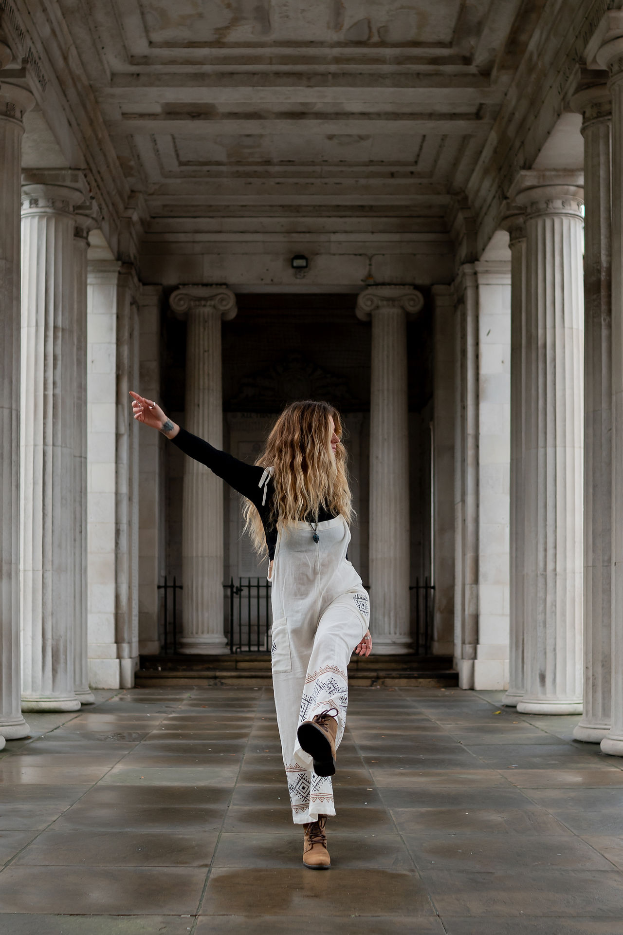 Liverpool clothing designer Ruby Sparrow dancing in Southport during her personal branding photoshoot.
