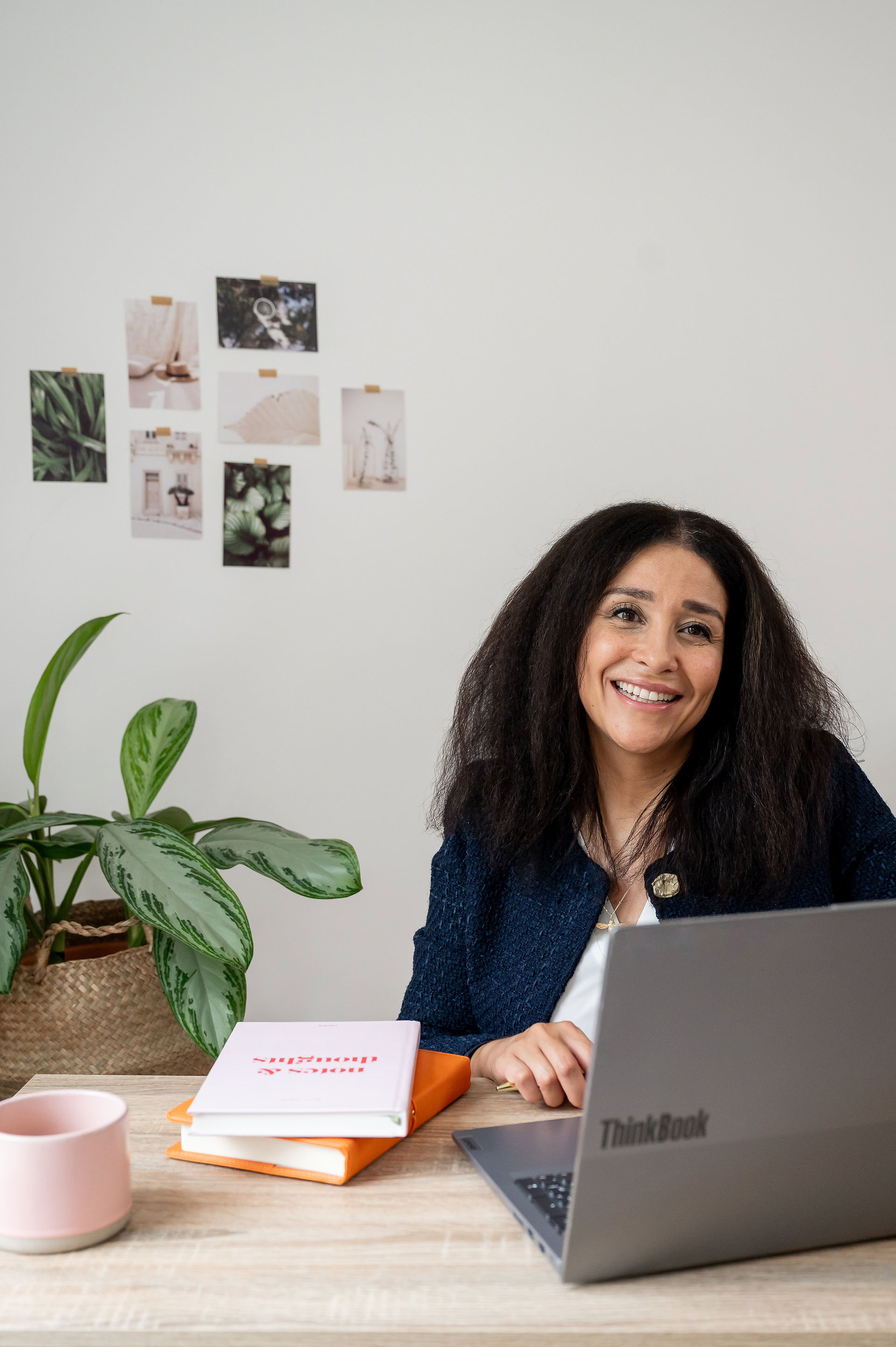 Founder of Abeni Lane Skincare working on her laptop during a luxury founder brand photoshoot in Liverpool.