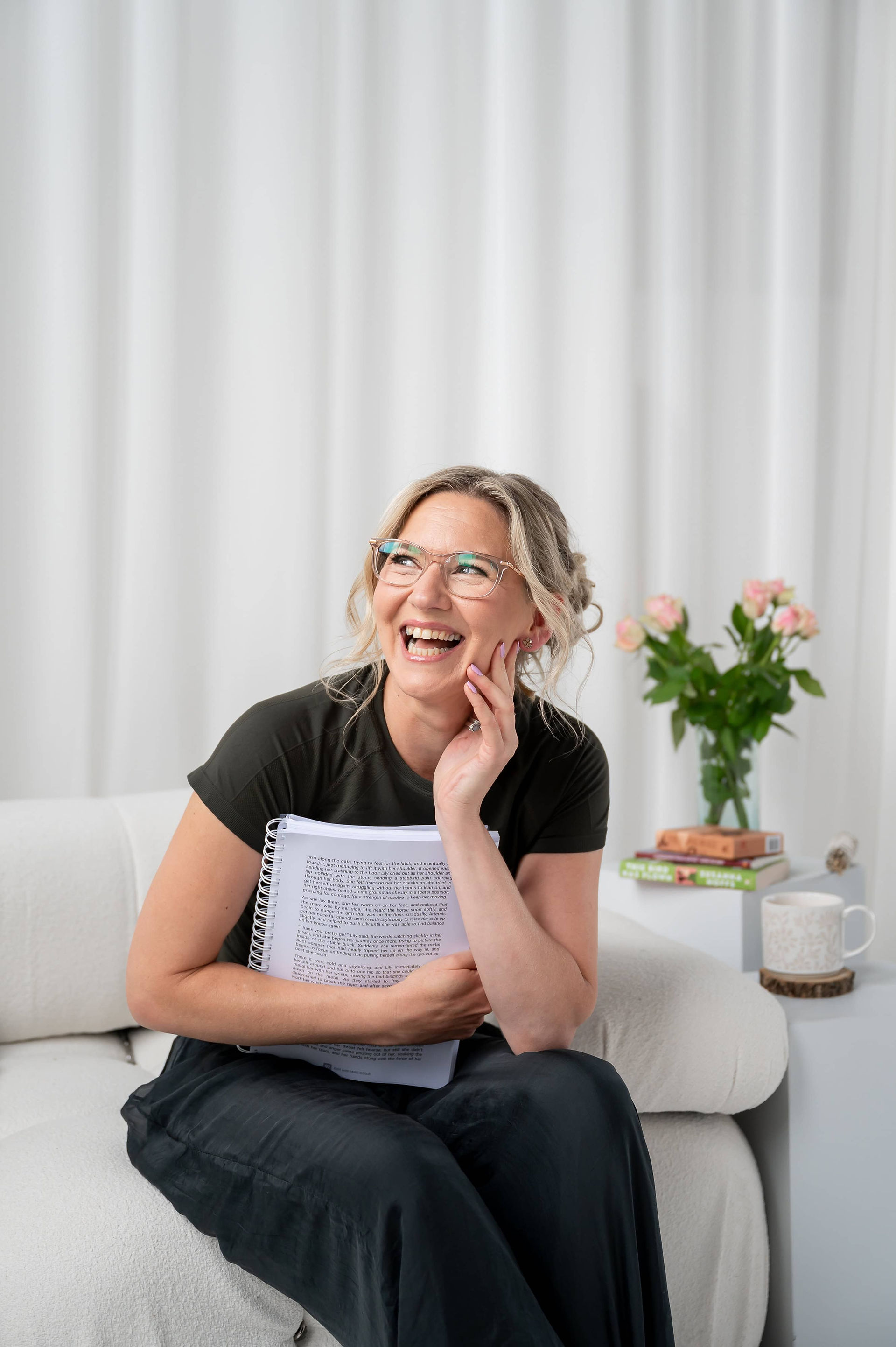 Vocal coach Emily Gervers laughing mid-conversation during her brand shoot