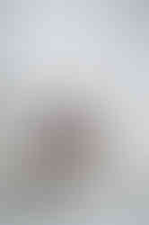 Founder sitting on a sofa reading a magazine during a relaxed lifestyle brand photoshoot.