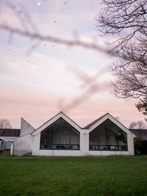Wellness retreat venue in Wales at sunset.