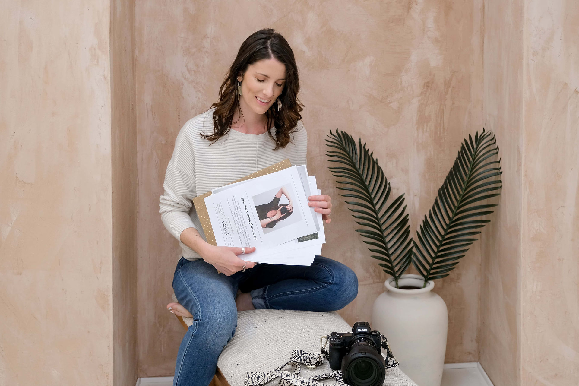 Brand photographer organizing brand shoot plan in Liverpool Studio.