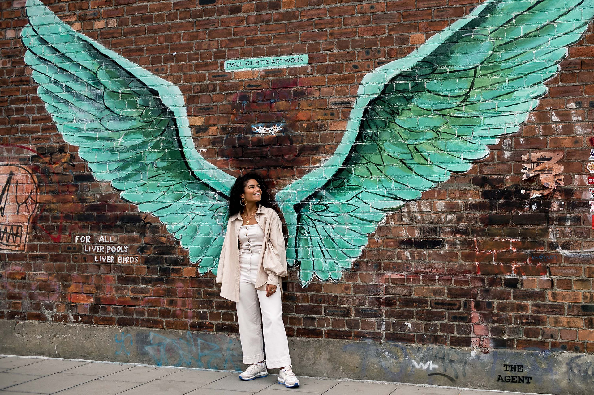 Woman in front of Jamaica street Wings in Liverpool
