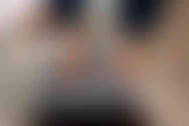 Close-up of hands typing on a laptop during an Abeni Lane Skincare founder brand photoshoot in Liverpool.