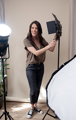 Photography mentor teaching lighting setup for DIY brand shoots in New Brighton Photography Studio.