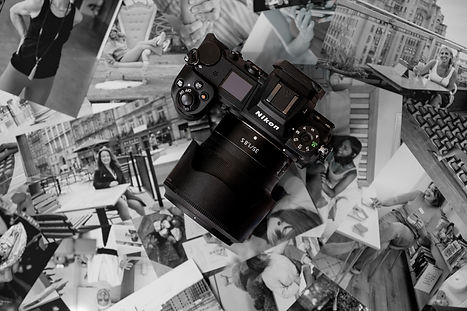 A black and white close-up of a Nikon Camera laying on top of black and white branding photography photos.