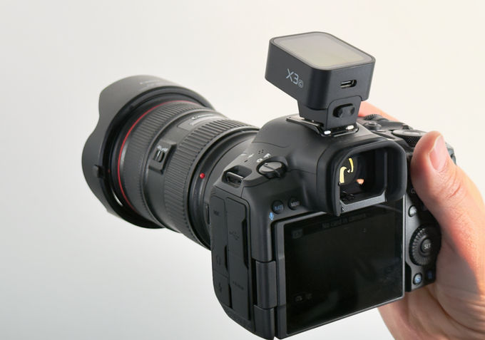 Rear controls and viewfinder of the Canon EOS R5 Mark II with a Godox trigger