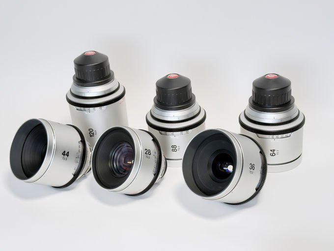 Six GL Optics Mamiya 645 lenses with front elements and focal-length markings visible