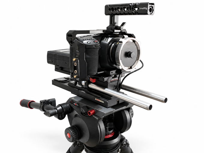 Blackmagic Design Pocket Cinema Camera 4K in cage on support rig against white background