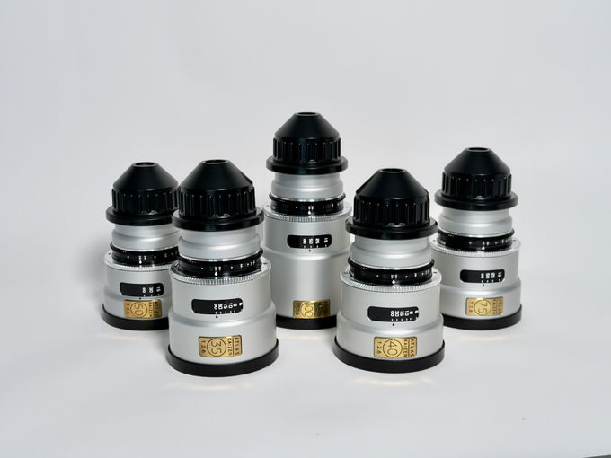 Five Atlas Kaizen 65 lenses showing capped mounts, focus scales and focal-length labels
