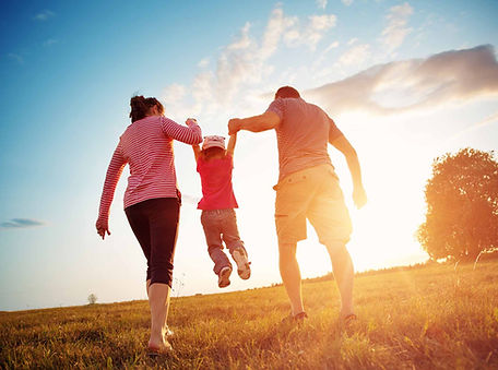 Happy family enjoying sunset walk