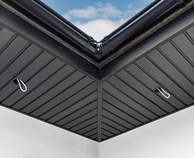 Close-up of a black roof with a sky view and simple design