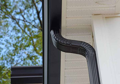 Black guttering on a white house. Fascia and Soffits installed. Velro Roofing Solutions.