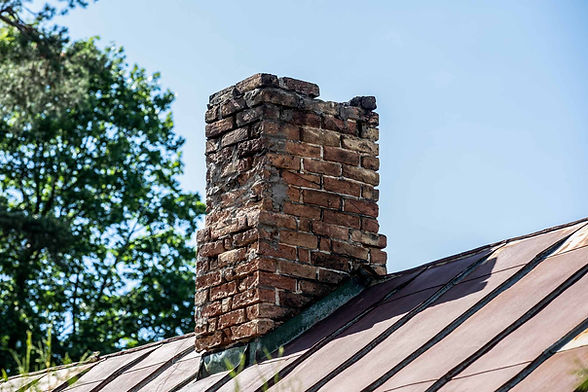 Brick chimney on the roof, CHIMNEY REPAIRS, visible text not available, background