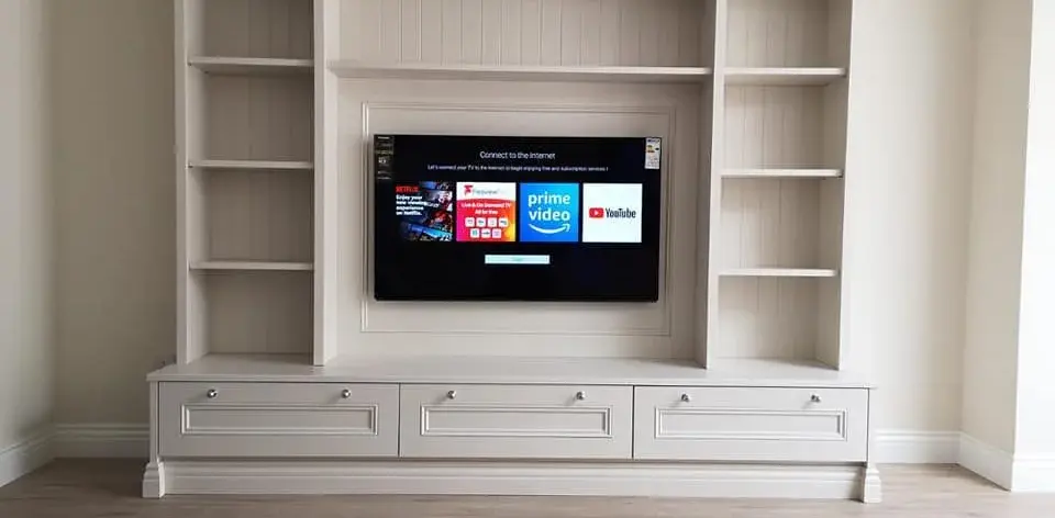 Elegant Elphin fitted furniture: cream TV unit with shelving