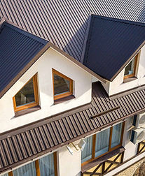 Brown roof with windows and High View Roofing & Guttering detail.