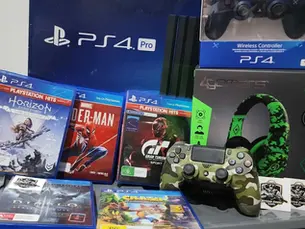 An assortment of PlayStation games, a controller, headphones, and a PlayStation 4 Pro