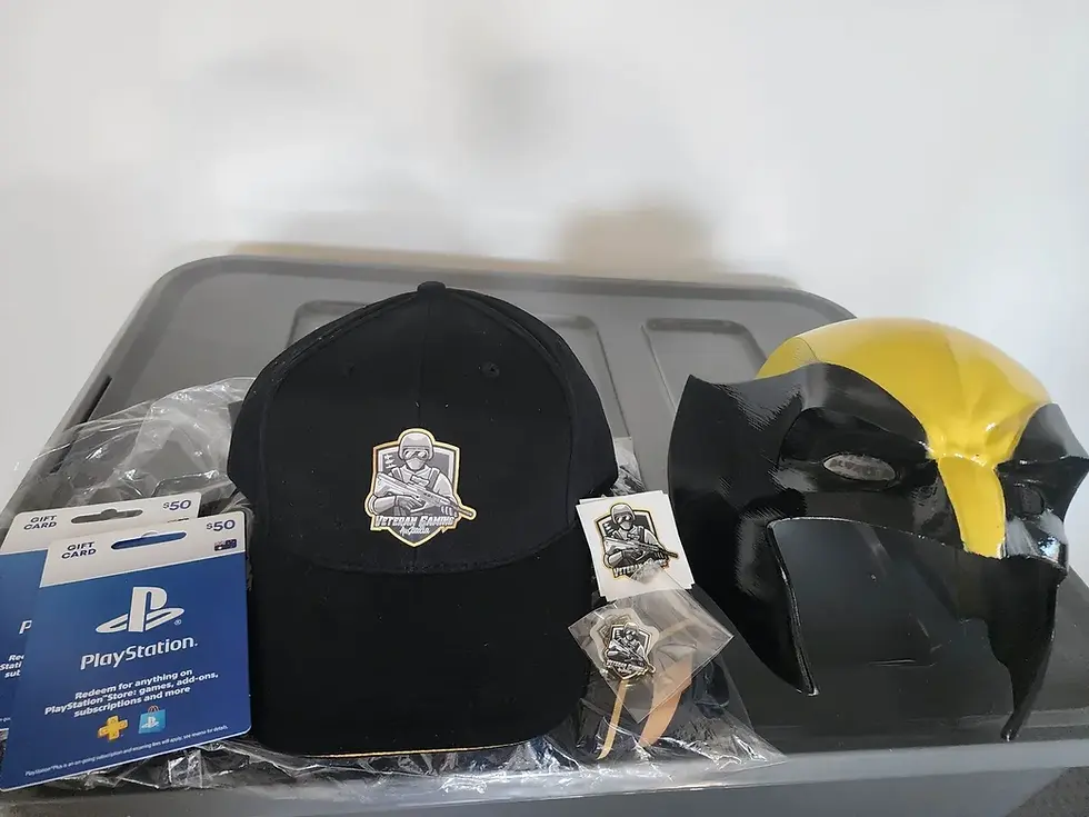 Care Package sent to Clay containg PlayStation gift cards, Veteran Gaming merch, and a Wolverine mask