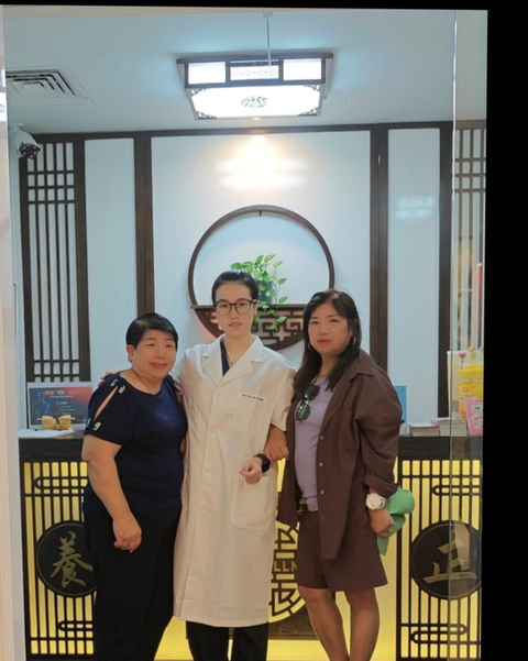 Smiling guests and TCM practitioners at Better Wellness Orchard Singapore.