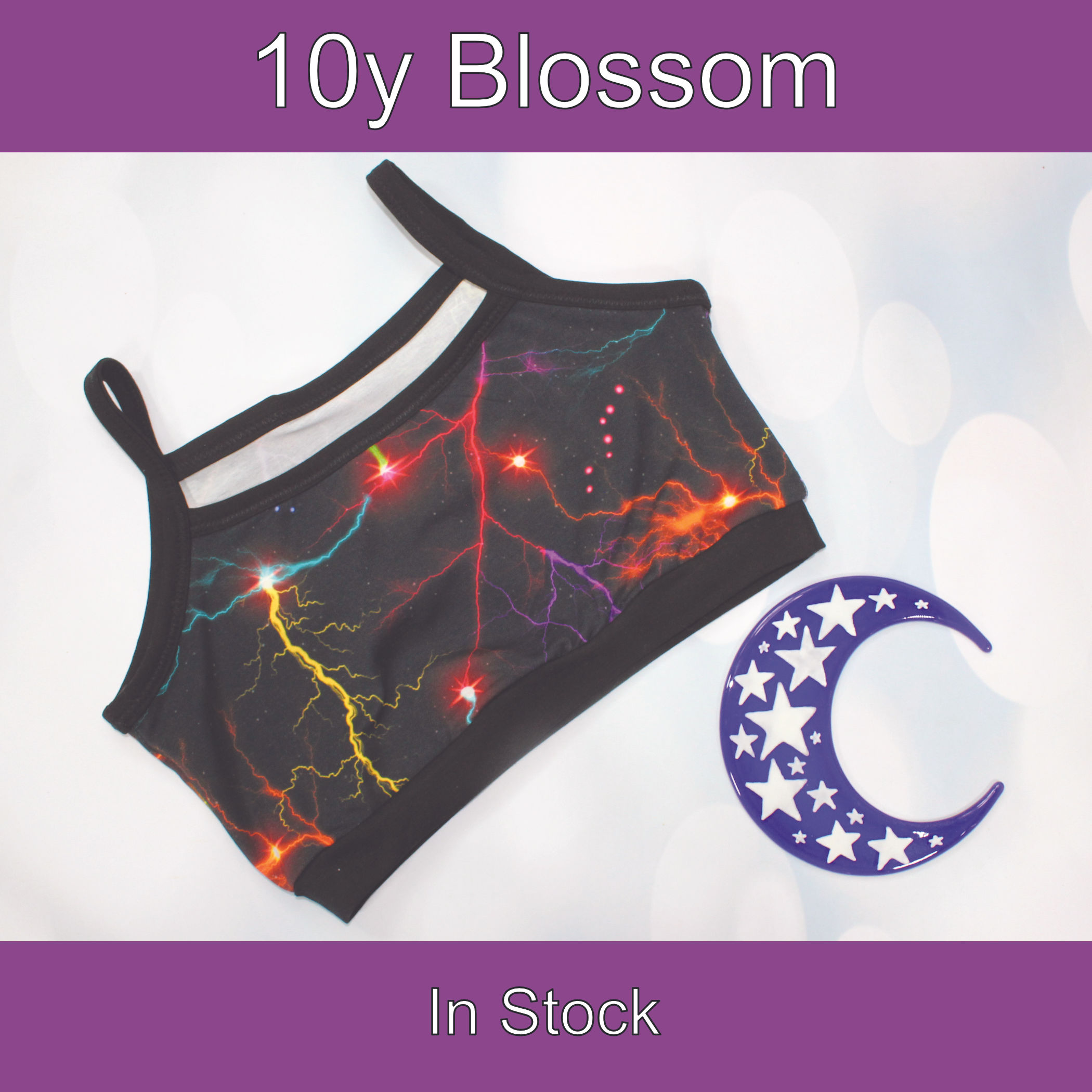 10y Blossom bra. Colourful lightening print with black bands and binding