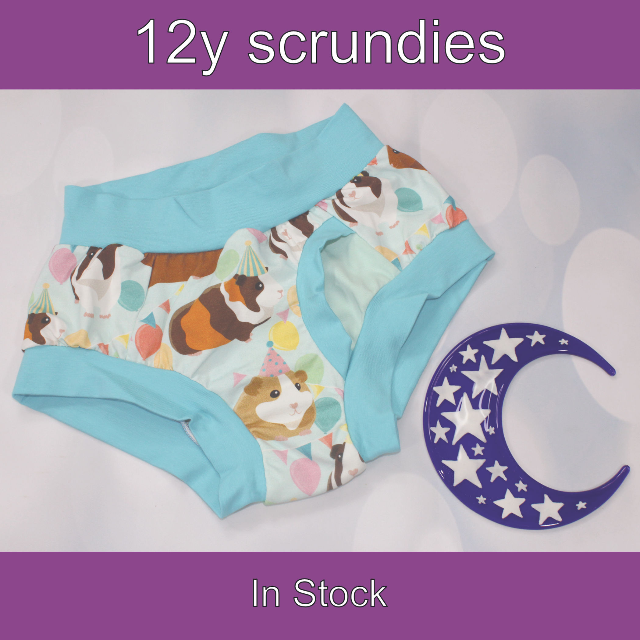 12y Child fly scrundies. Guinea pig party prints with soft blue