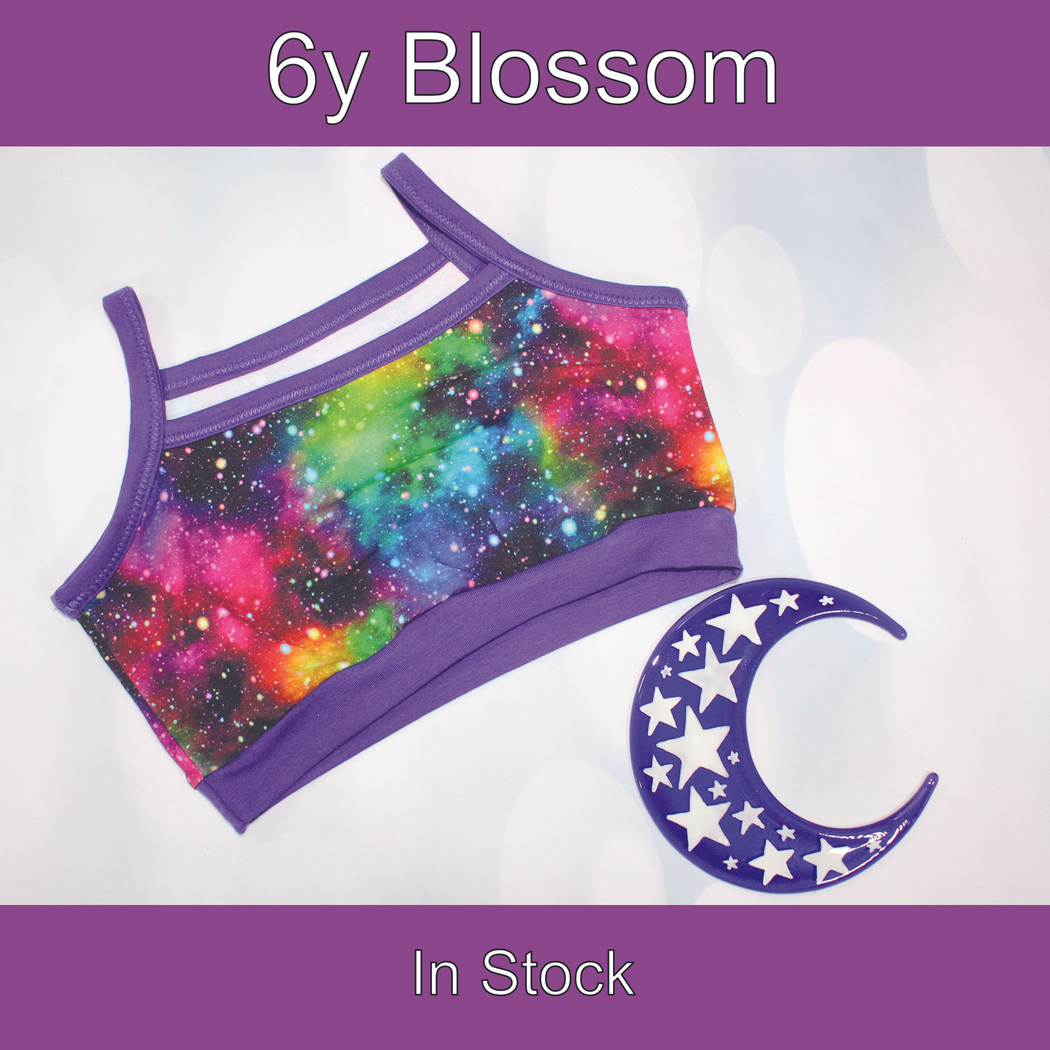 6y Blossom bra. Rainbow galaxy print with purple bands and binding