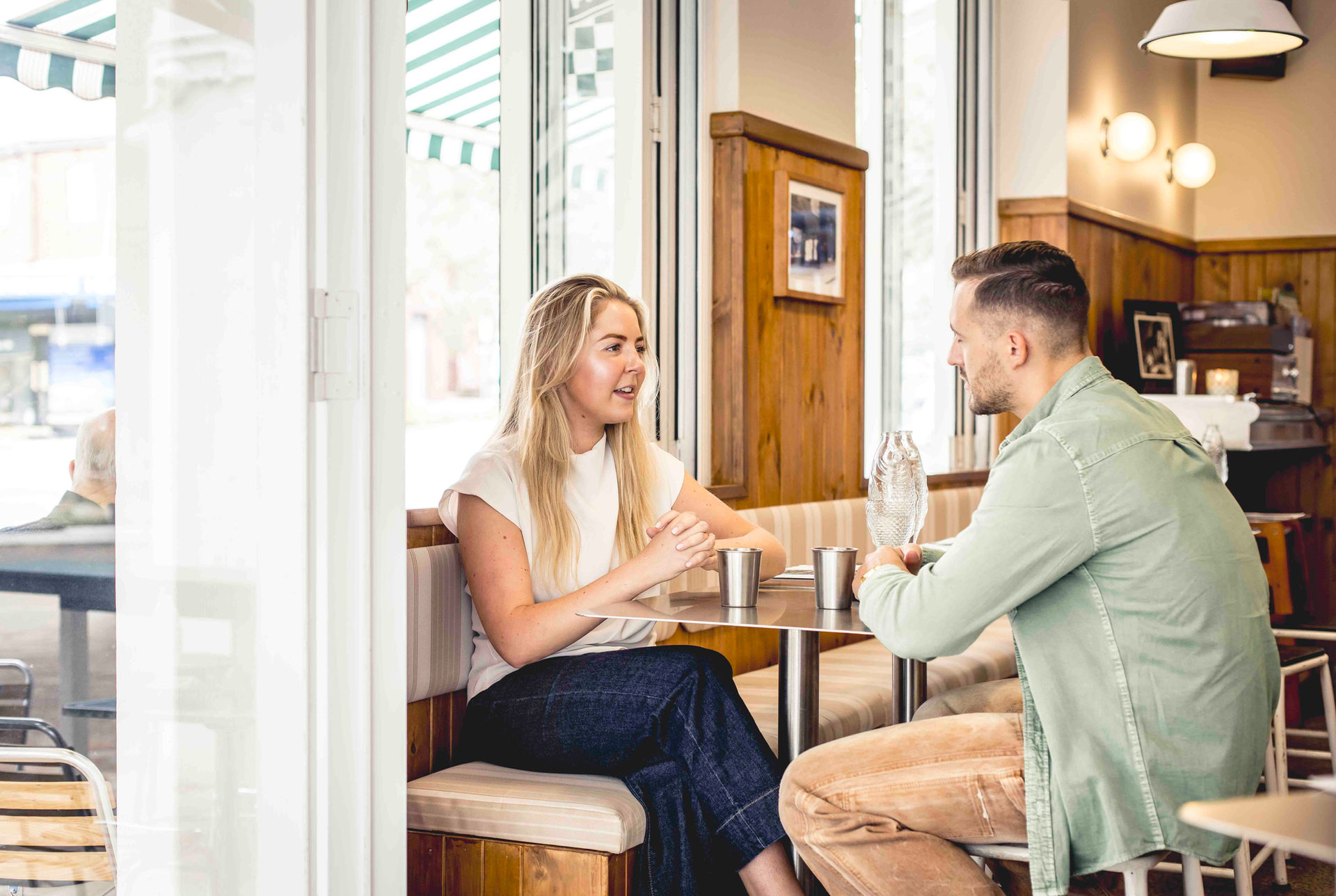 Woman having casual business meeting with a client at a cafe in Bondi. Personal branding photo shoot. Small business personal branding photographer Suzanne Stevenson